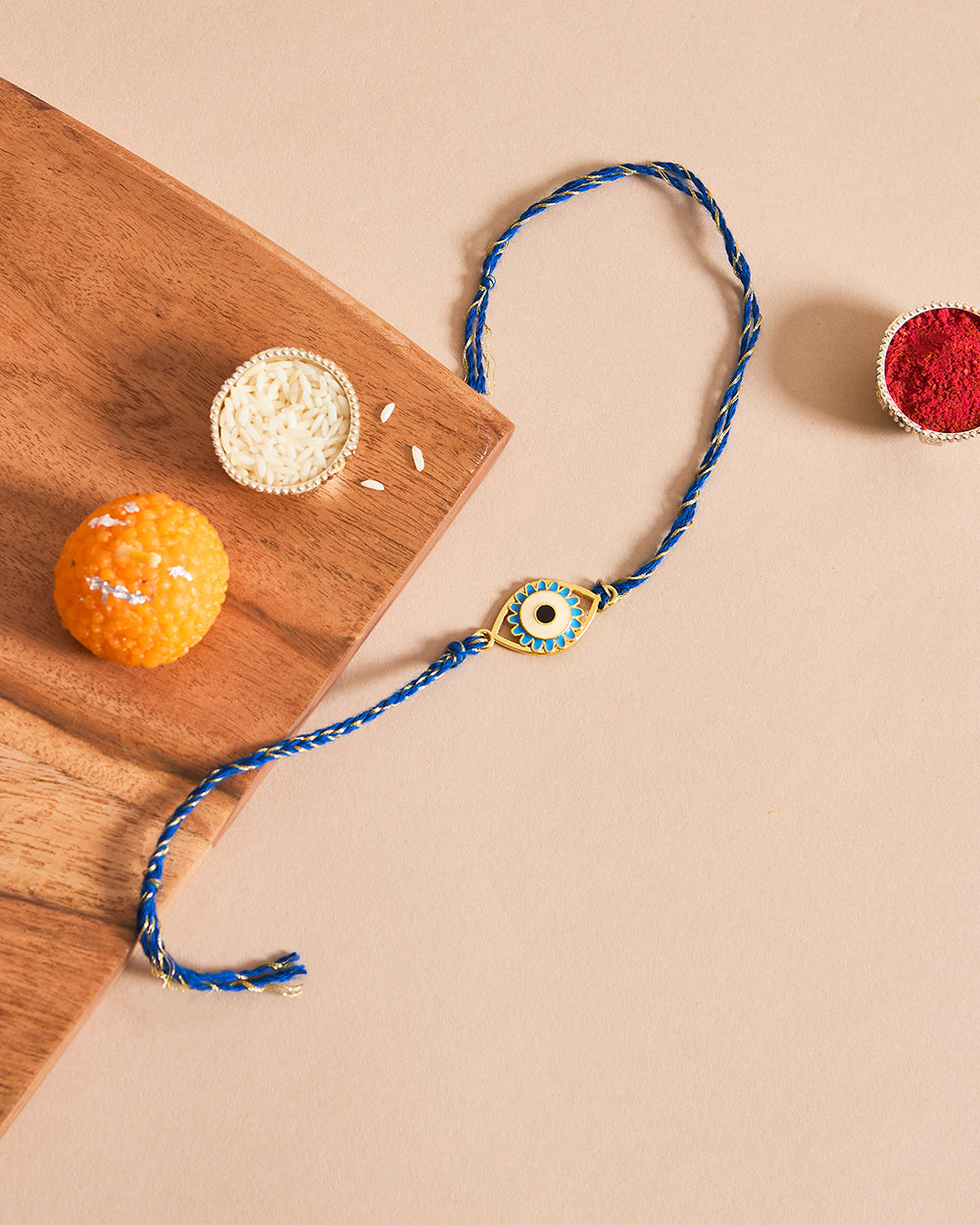 Evil-Eye Blue Rakhi - Brass Motif
