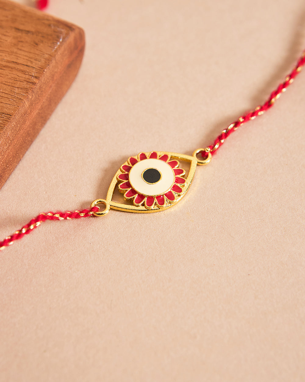 Evil-Eye Red Rakhi - Brass Motif